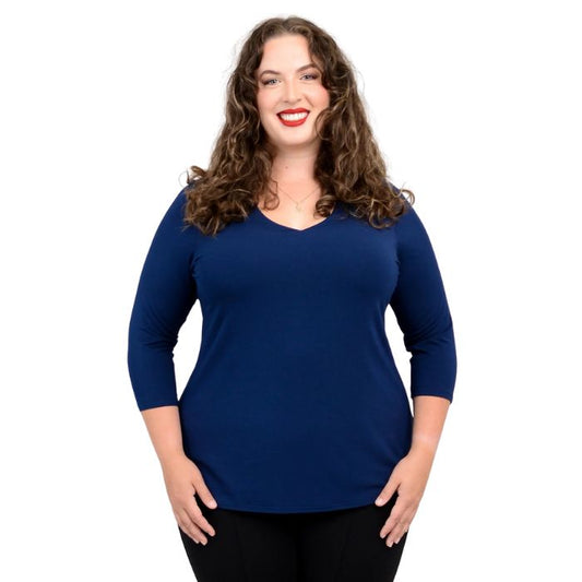 top half of female model wearing mia indigo blue three quarter sleeve top front view of top on white background