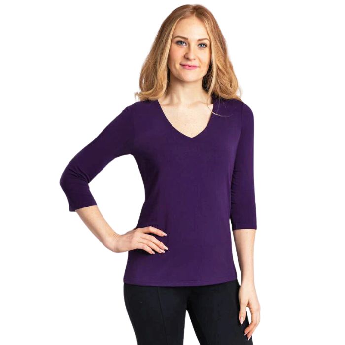 top half of female model wearing mia royal purple three quarter sleeve top front view on white background