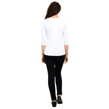 female model wearing mia white three quarter sleeve top and nadia black pants back view on white background