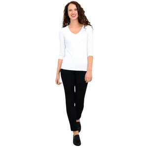 female model wearing mia white three quarter sleeve top and nadia black pants front view on white background