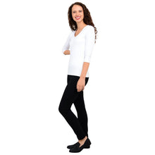 female model wearing mia white three quarter sleeve top and nadia black pants side view on white background