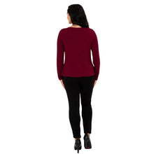 female model wearing mona burgundy red long sleeve top and nadia black pants back view on white background