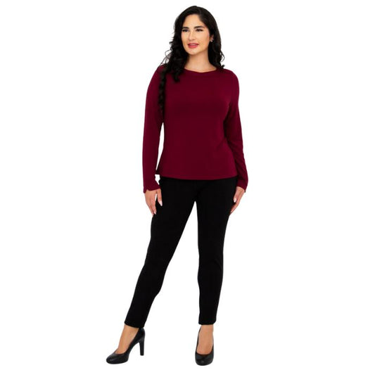 female model wearing mona burgundy red long sleeve top and nadia black pants front view on white background