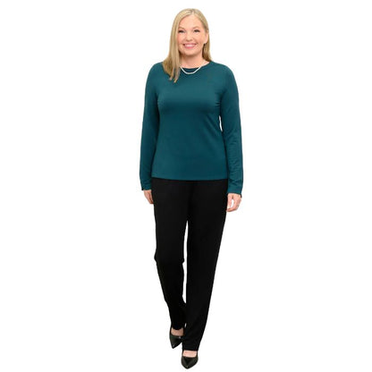 woman wearing crystal teal green mona top and black clair pants front view set on a white background