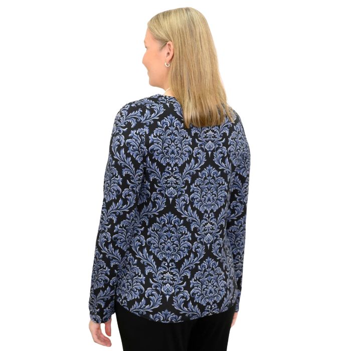 woman wearing indigo empire print mona top waist up back view set on a white background