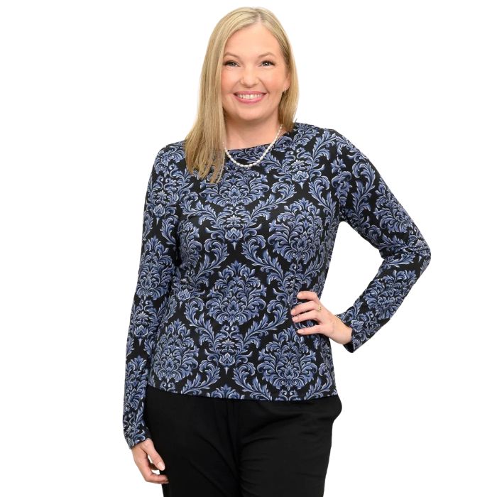 woman wearing indigo empire print mona top waist up front view set on a white background