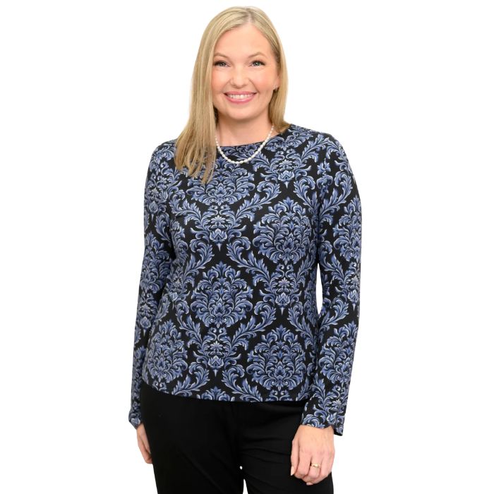 woman wearing indigo empire print mona top waist up front view set on a white background