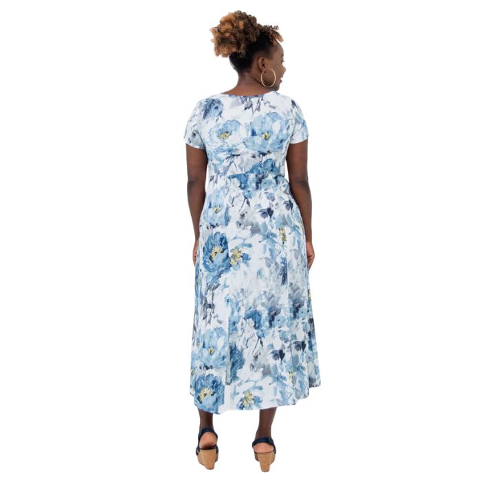 female model wearing muse print morgan dress back view on white backgreond