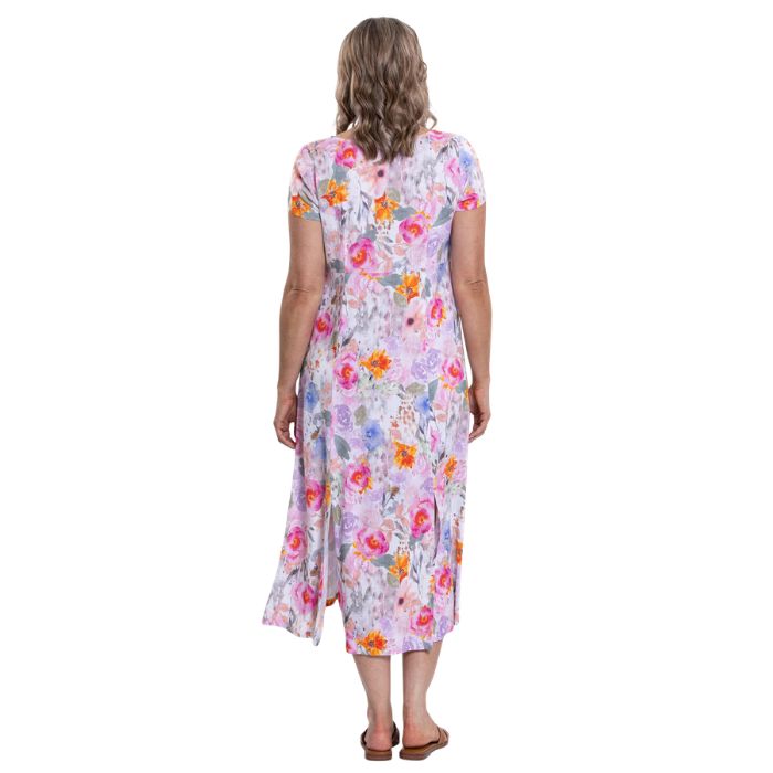 female model wearing pink bouquet print morgan dress back view on white backgreond