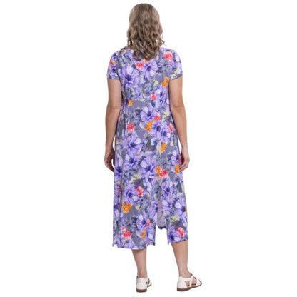 female model wearing violet bloom print morgan dress back view on white backgreond