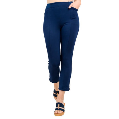 female model wearing indigo blue nadine cropped pants front view on white background
