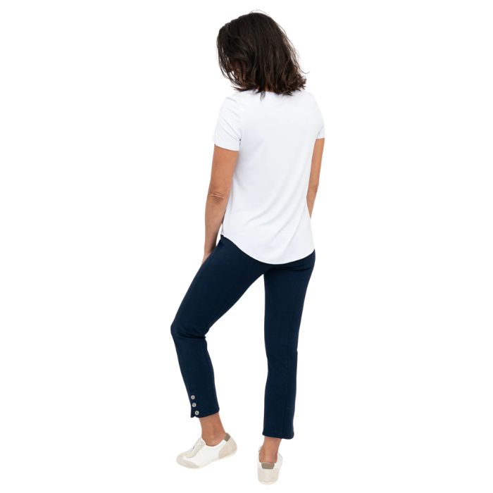 female model wearing indigo blue nadine cropped pants and white tessa tee back view on white background