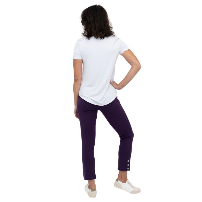female model wearing royale purple nadine cropped pants and white tessa tee back view on white background