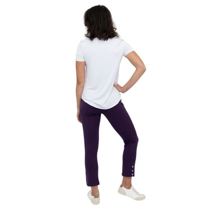 female model wearing royale purple nadine cropped pants and white tessa tee back view on white background