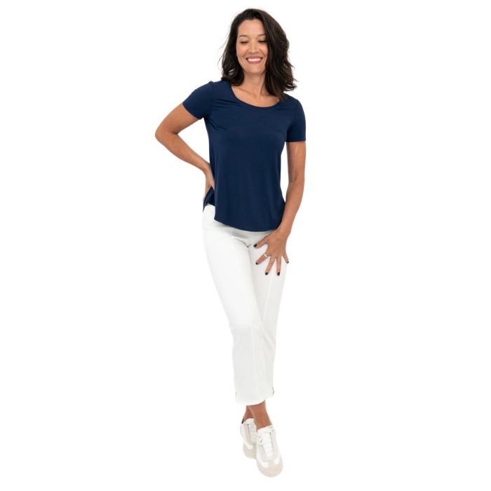 female model wearing white nadine cropped pants and indigo blue tessa tee front view on white background