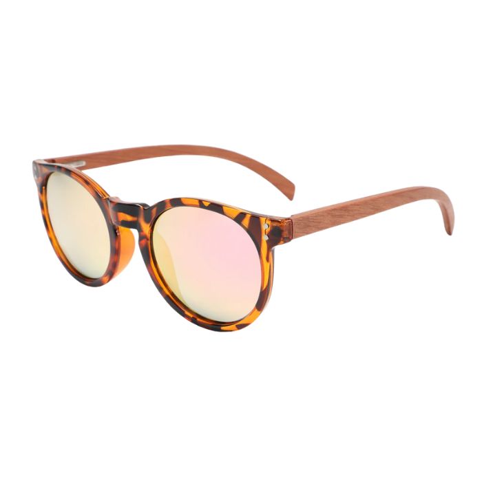 new zealand sunglasses tortoise frames and rose glod lenses over view on white background