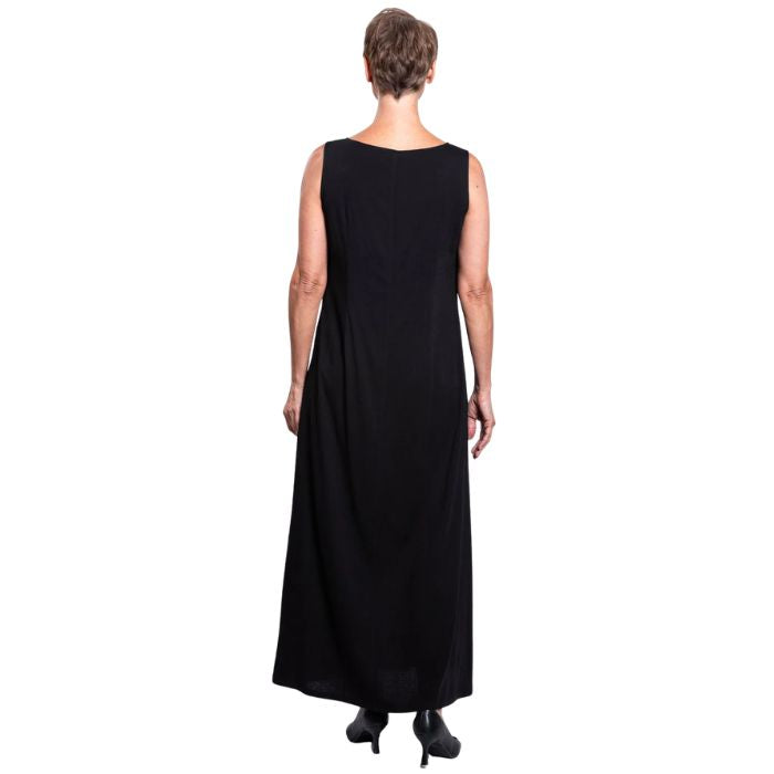 female model wearing black patricia dress back view on white background