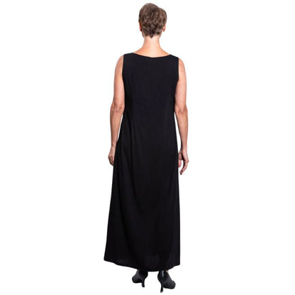 female model wearing black patricia dress back view on white background