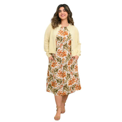 female model wearing khaki tapestry print patricia dress and marigold isabella sweater front view on white background
