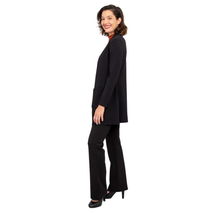 female model wearing black pauline jacket tonya top and black daya pants side view on white background