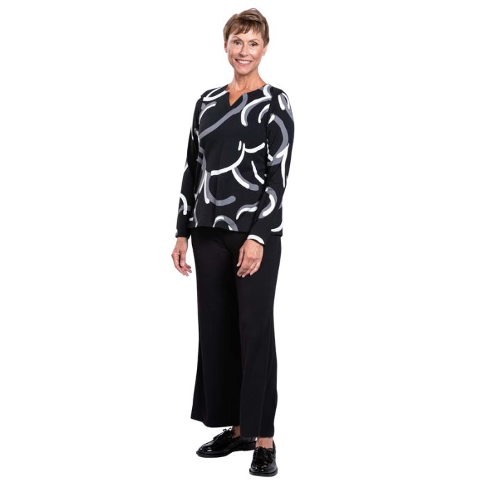 woman wearing black white focus print peggy top and black parker pants front view set on a white background