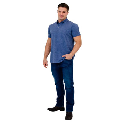 male model wearing denim blue phil polo shirt and blue jeans front view on white background