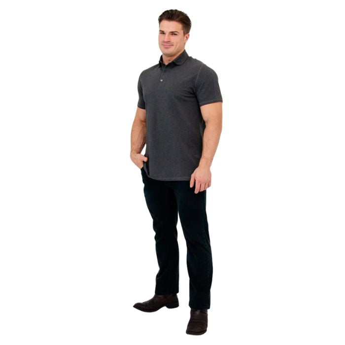 male model wearing graphite grey phil polo shirt and blue jeans front view on white background