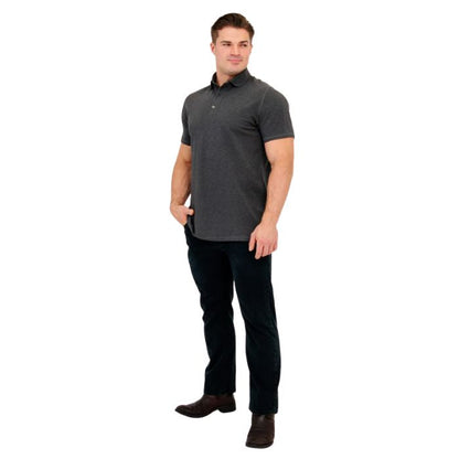 male model wearing graphite grey phil polo shirt and blue jeans front view on white background