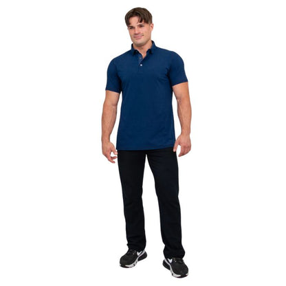male model wearing indigo blue phil polo shirt and blue jeans front view on white background