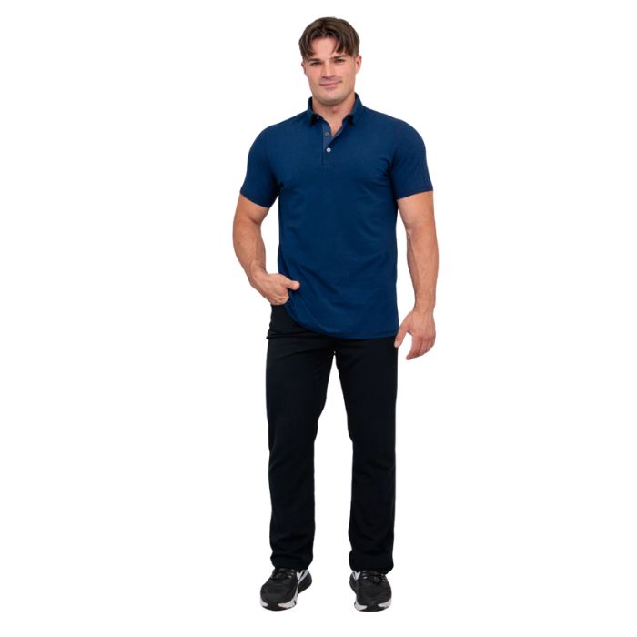 male model wearing indigo blue phil polo shirt and blue jeans front view on white background