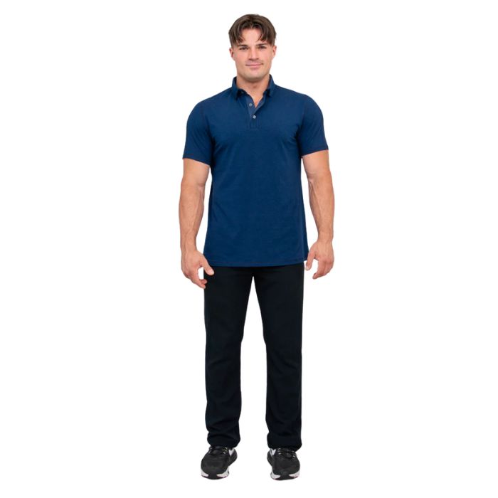 male model wearing indigo blue phil polo shirt and blue jeans front view on white background