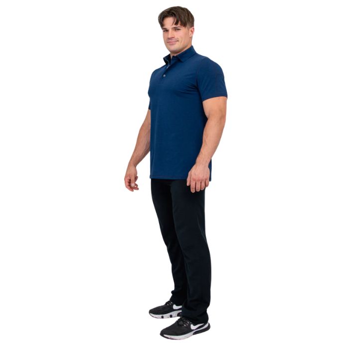 male model wearing indigo blue phil polo shirt and blue jeans side view on white background