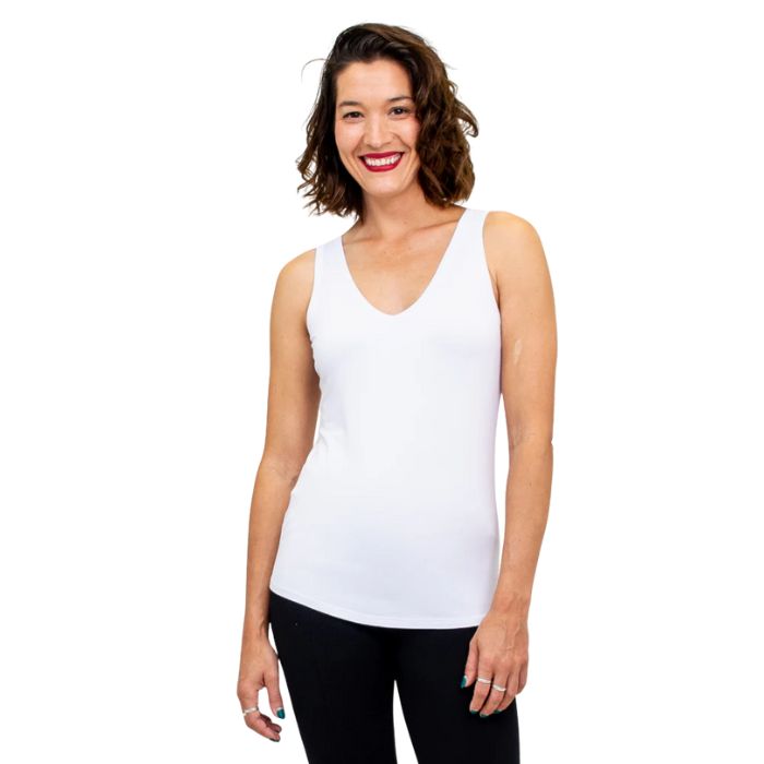 top half of female model wearing white reanna tank top top front view on white background