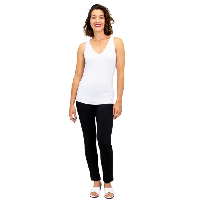 female model wearing white reanna tank top and black nadia pants front view on white background