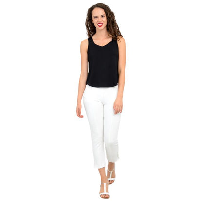 female model wearing black ritzy tank top and white nadine cropped pants front view on white background
