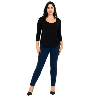 female model wearing black ritzy top and indigo blue nadia pants front view on white background