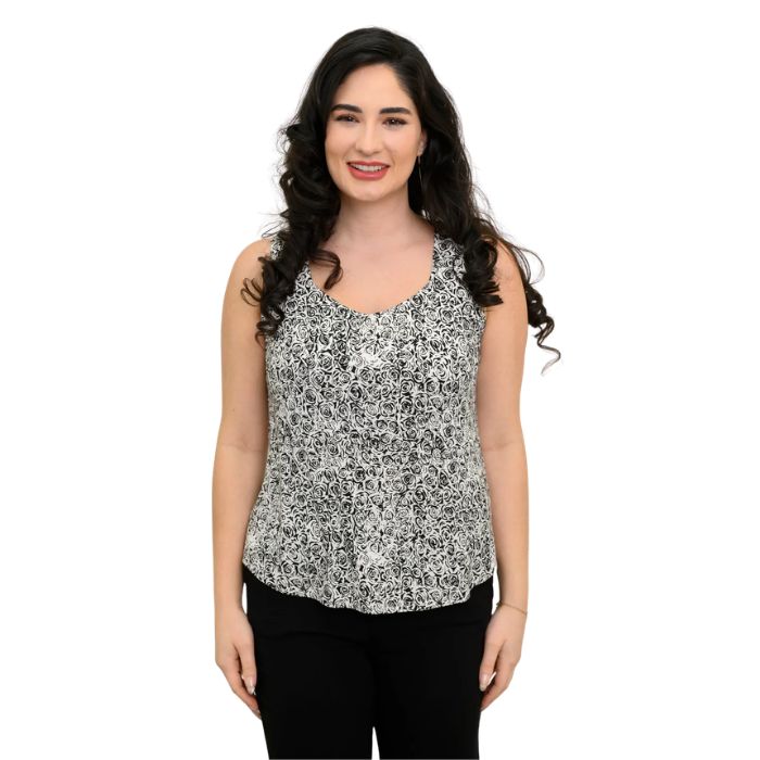 female model wearing black and white rosette print ritzy tank top front view on white background