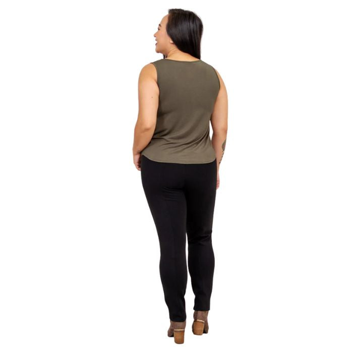 female model wearing khaki green ritzy tank top and black nadia pants back view on white background