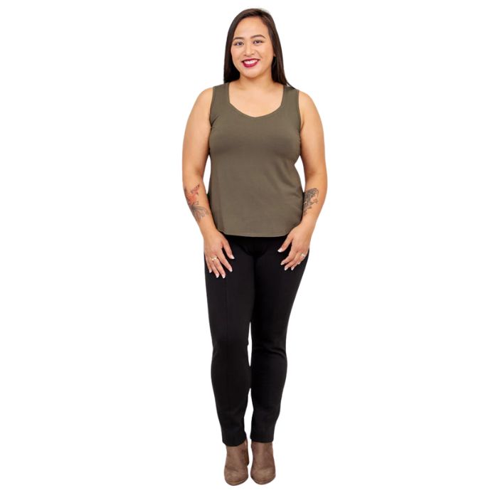 female model wearing khaki green ritzy tank top and black nadia pants front view on white background