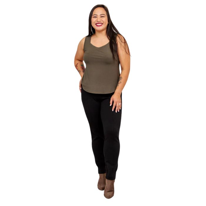 female model wearing khaki green ritzy tank top and black nadia pants front view on white background