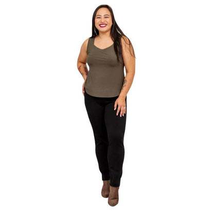 female model wearing khaki green ritzy tank top and black nadia pants front view on white background