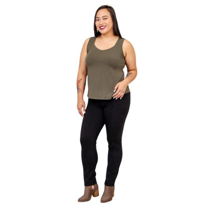 female model wearing khaki green ritzy tank top and black nadia pants side view on white background