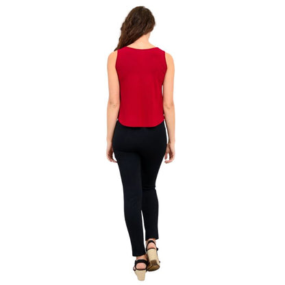 female model wearing lipstick red ritzy tank top and black nadia pants back view on white background