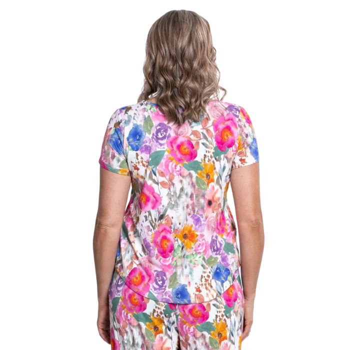 female model wearing pink bouquet print ritzy top back view on white background