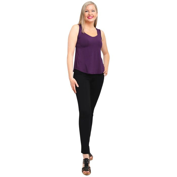 female model wearing royale purple  ritzy tank top and black nadia pants front view on white background