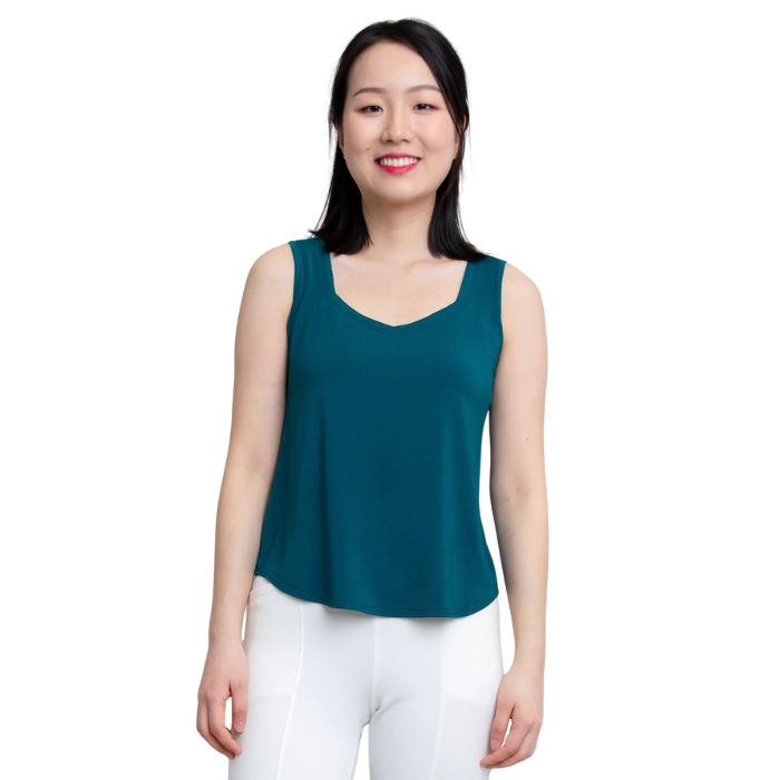 female model wearing teal green ritzy tank top front view on white background