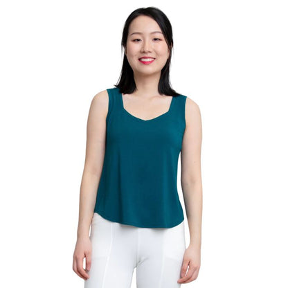 female model wearing teal green ritzy tank top front view on white background