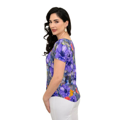 female model wearing violet bloom print ritzy top side view on white background