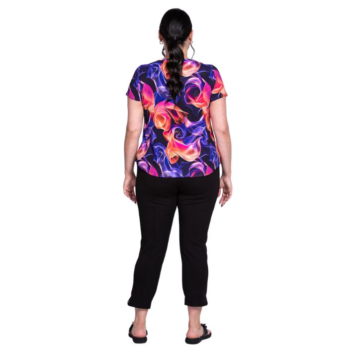female model wearing violet daze print ritzy top and black nadine cropped pants back view on white background