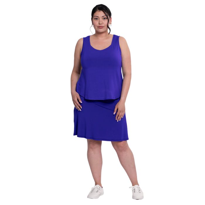 female model wearing violet purple  ritzy tank top and violet purple magna skort front view on white background